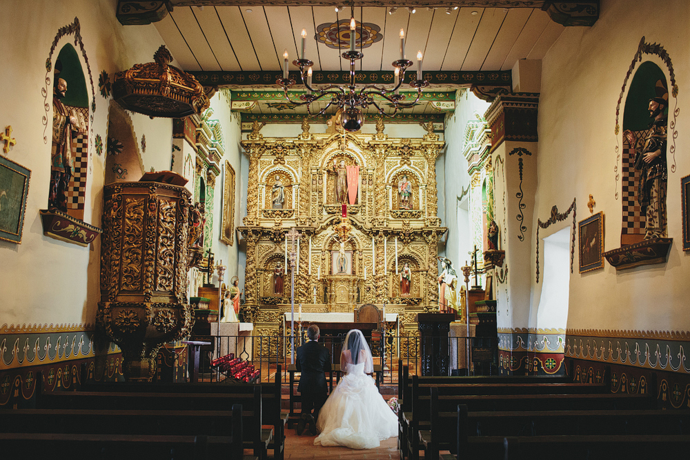 This is a photo of Parisa and Michael praying at the Mission.