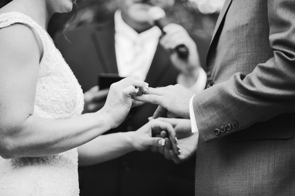 This is a great shot of them exchanging their rings.