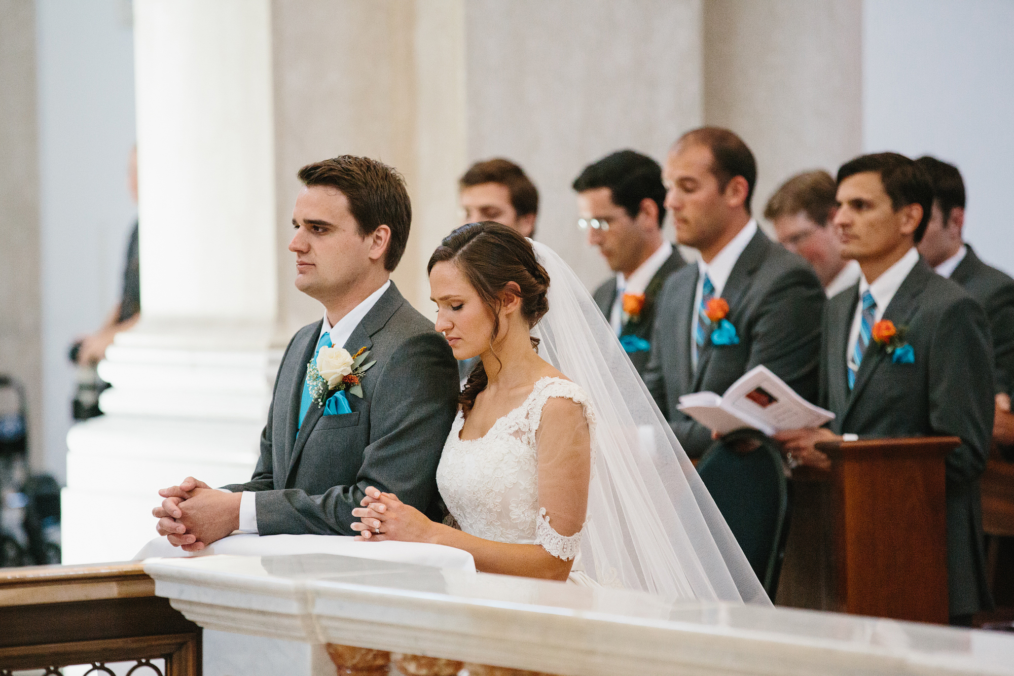 This is a photo of Annie and Chris praying at the front of the church.