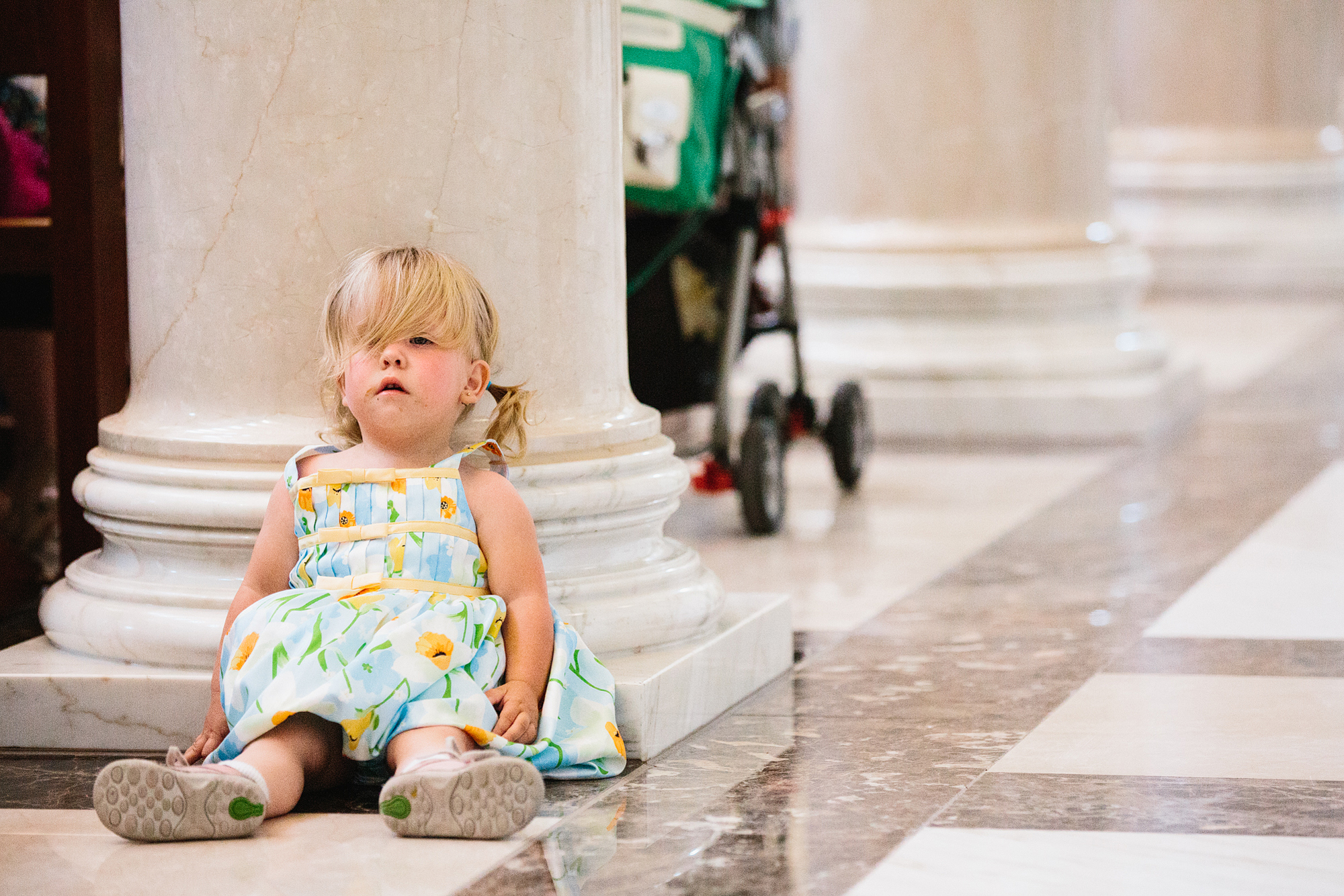 This is a photo of an adorable little girl trying to behave during the ceremony.