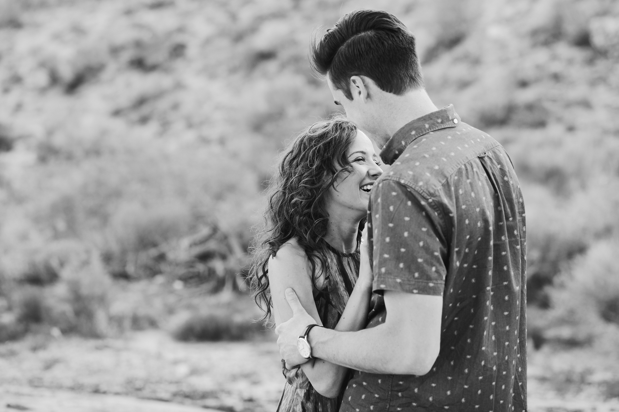 Jordan and Riley laughing during their engagement session. 