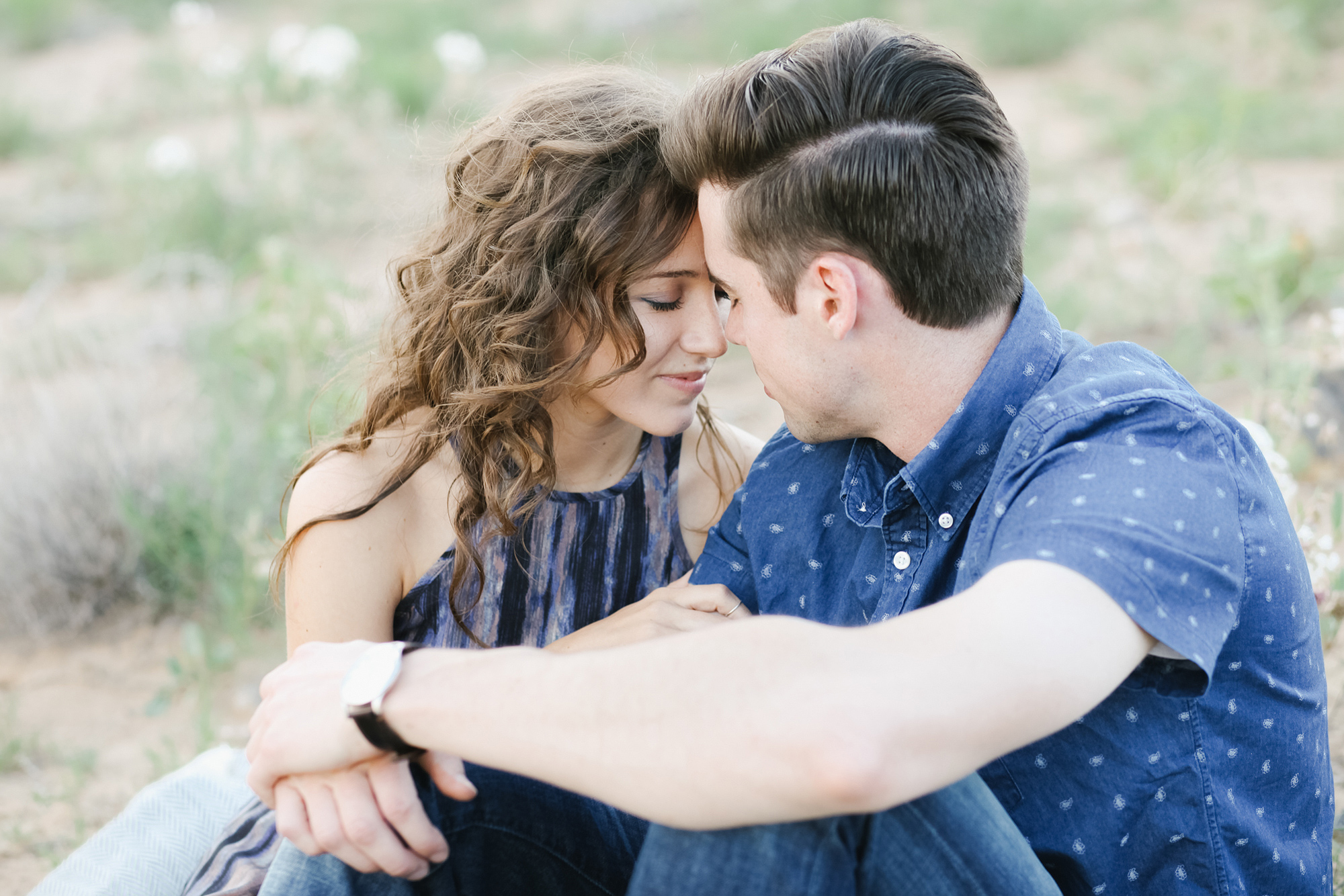 A cute moment between Jordan and Riley at their engagement session. Santa Fe wedding photographer.