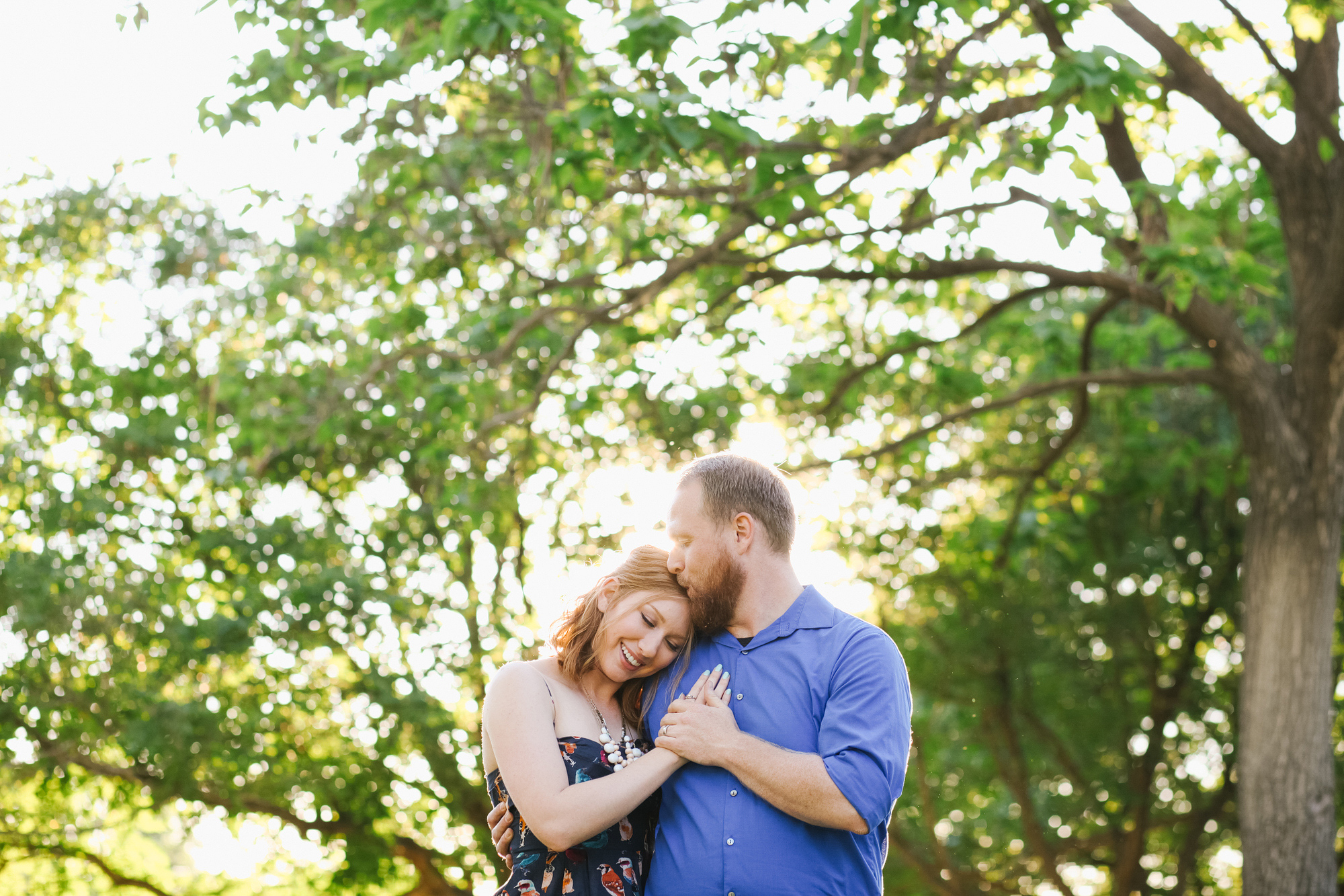 A cute moment of Tonya smiling and hugging Nick during their engagement session. 