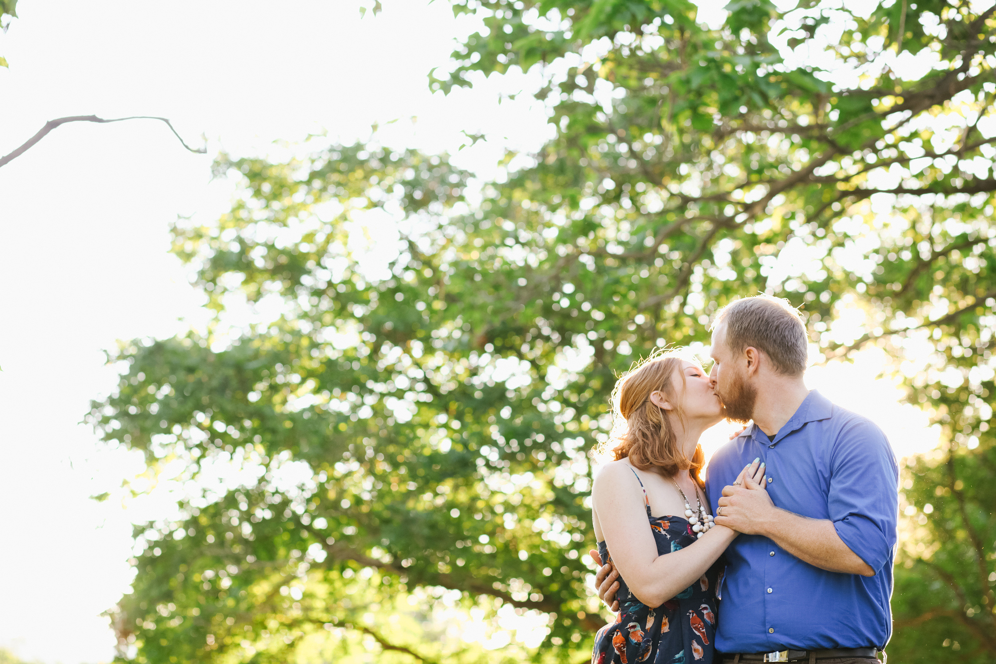 The couple kissing during their engagement session.