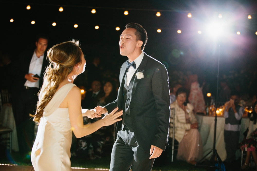 The groom is singing to his bride. So adorable!