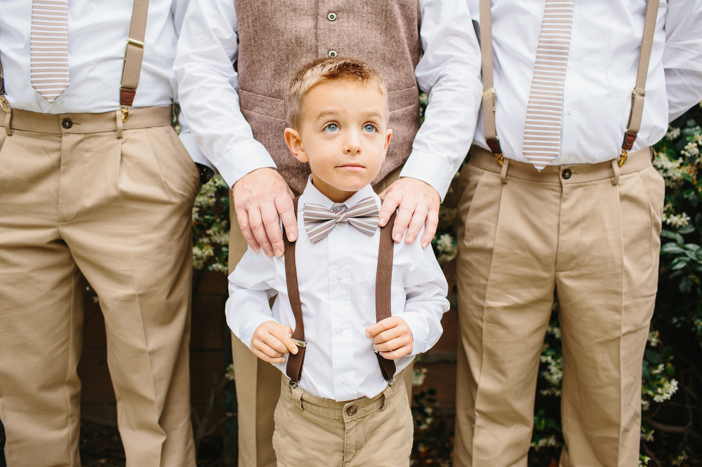 The adorable ring bearer wore a bow tie and suspenders. 