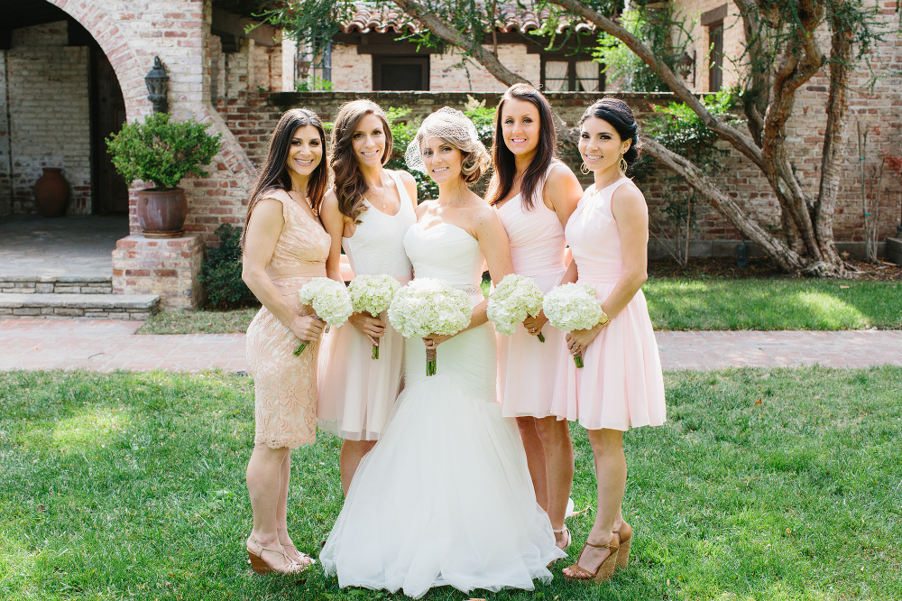 The bridesmaids wore light blush pink dresses. 