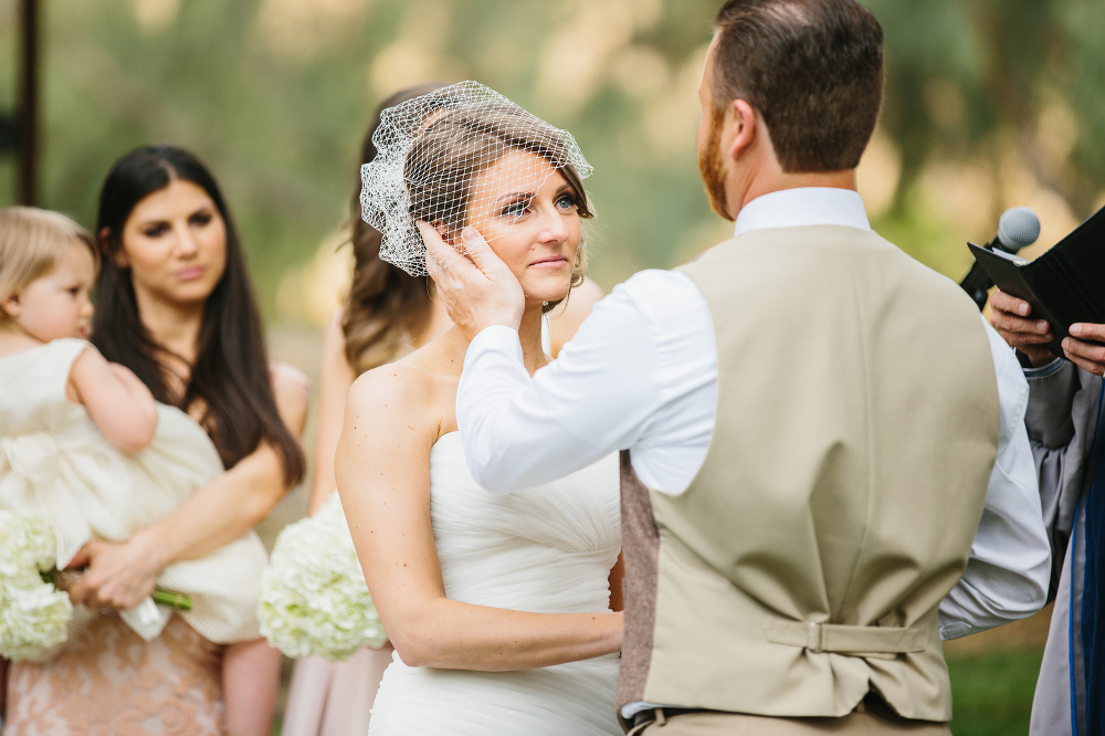 A sweet moment between the bride and groom during the ceremony. 