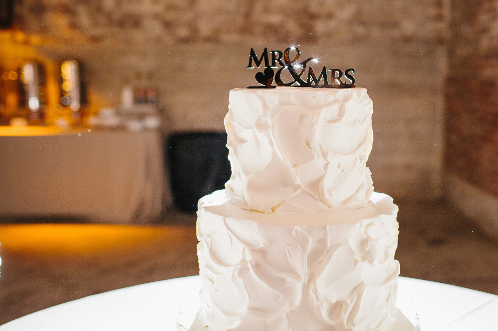 The cake had a beautiful Mr. and Mrs. cake topper on it. 