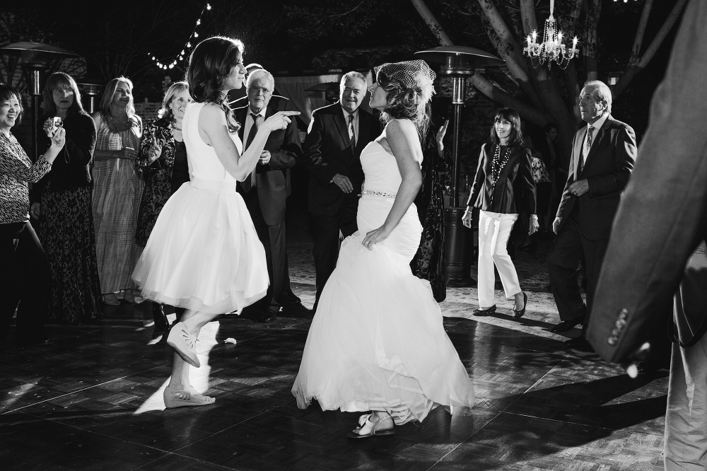 The bride and her sister having fun dancing during the reception. 