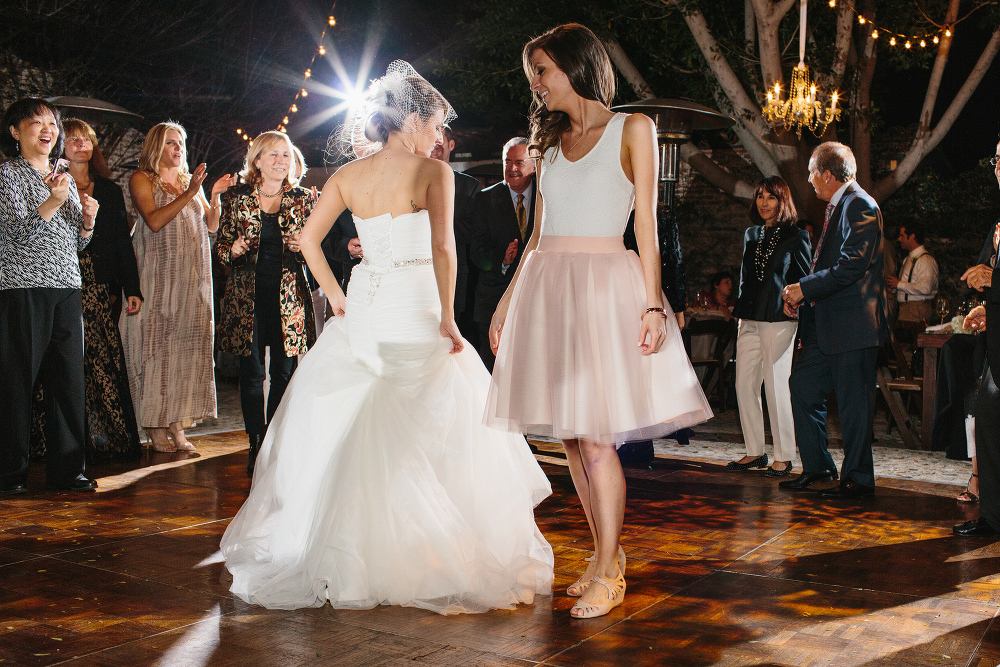 A cute dance off between the bride and her sister. 
