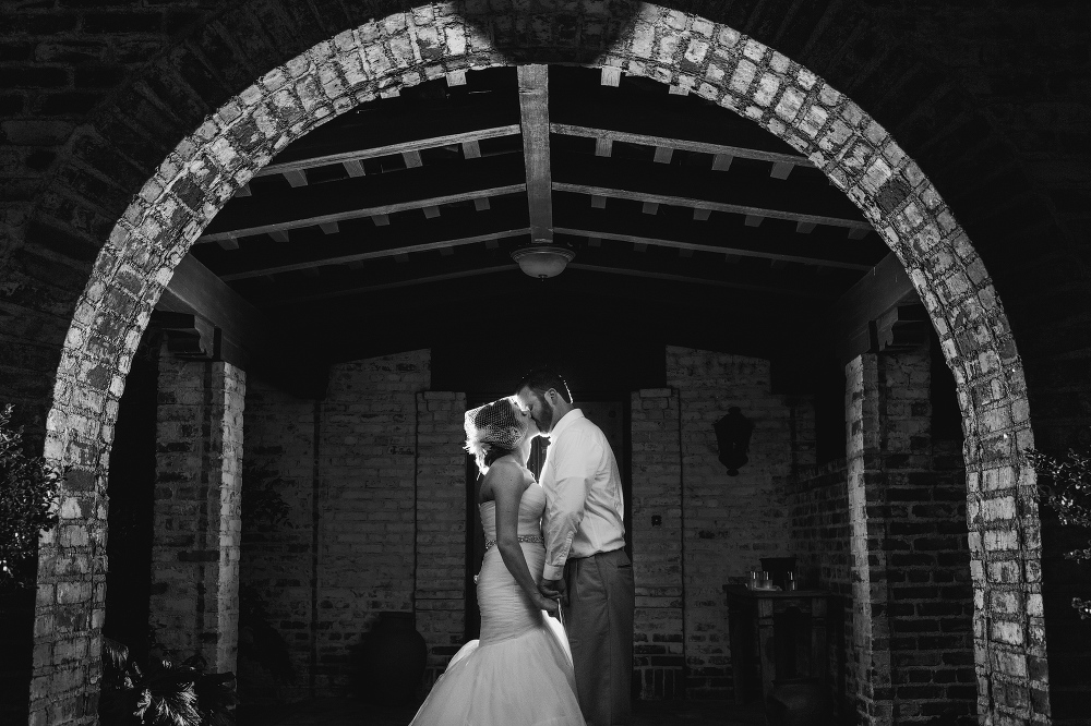 A beautiful black and white lit photo of Ewa and Chris at their wedding. 