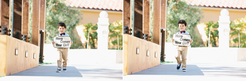 The adorable ring bearer held a sign when he walked down the aisle. 