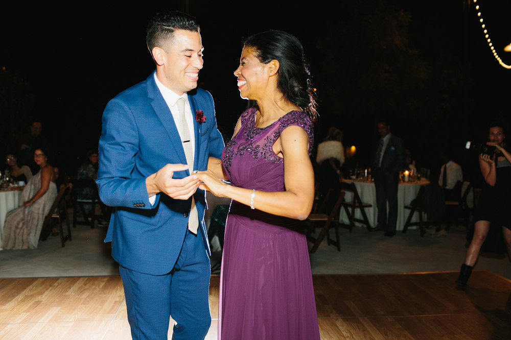 This is a photo of the groom dancing with his mom. 