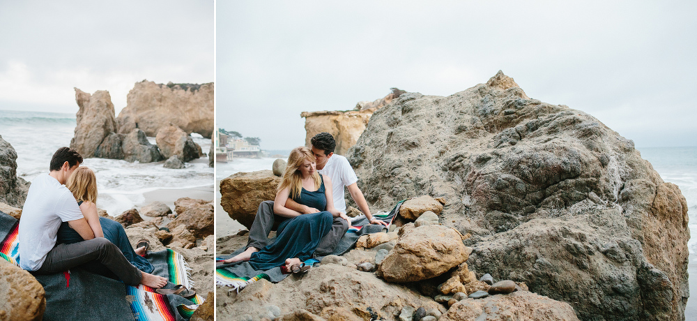 This is a photo of the couple on the rocks at the beach. 