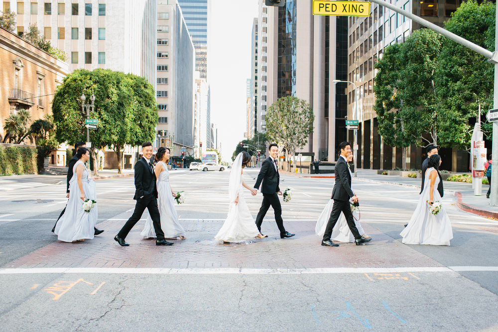 This is a photo of the full wedding party walking in Los Angeles. 