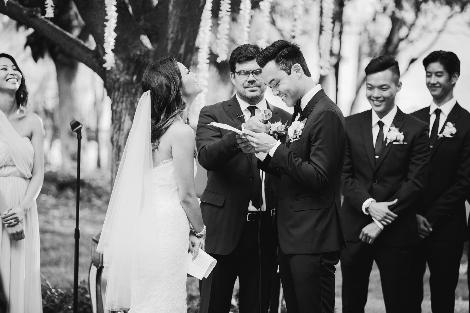 A photo of the groom reading his vows. 