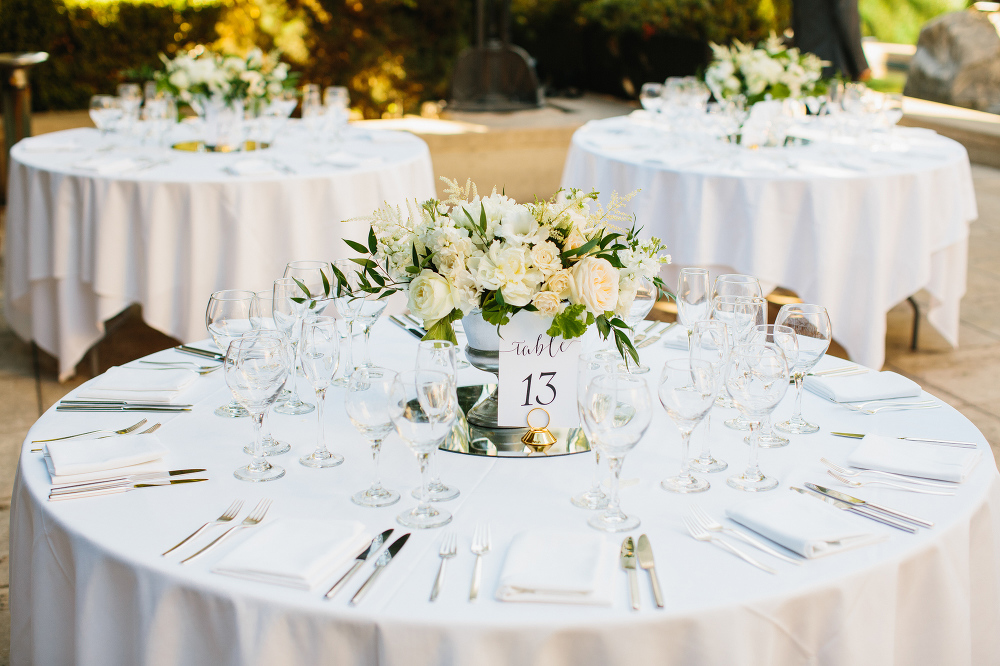 A photo of the reception centerpiece and table number. 