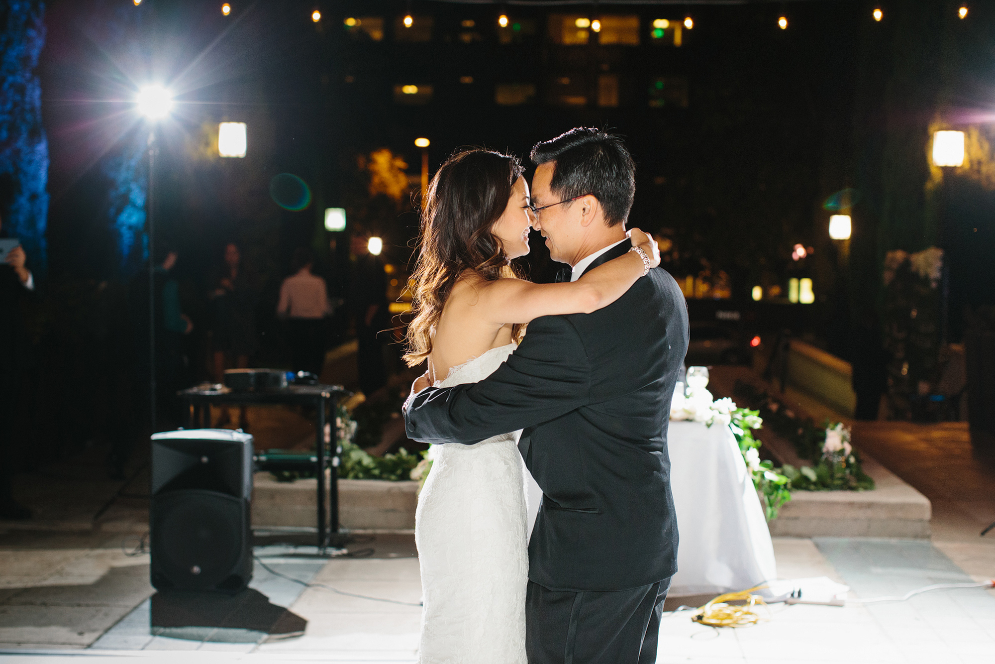 The bride danced with her dad. 