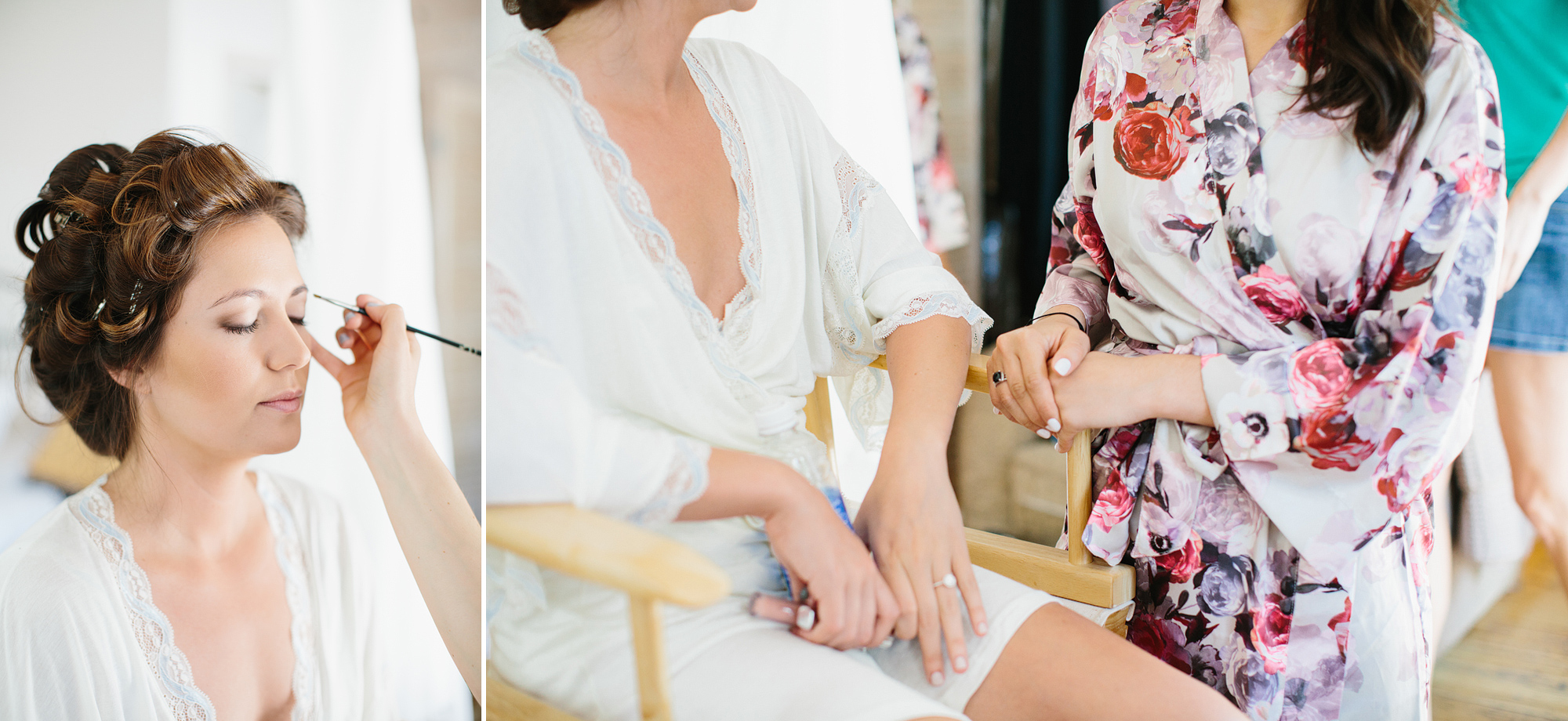 The bride getting her hair and make up done in a white robe. 