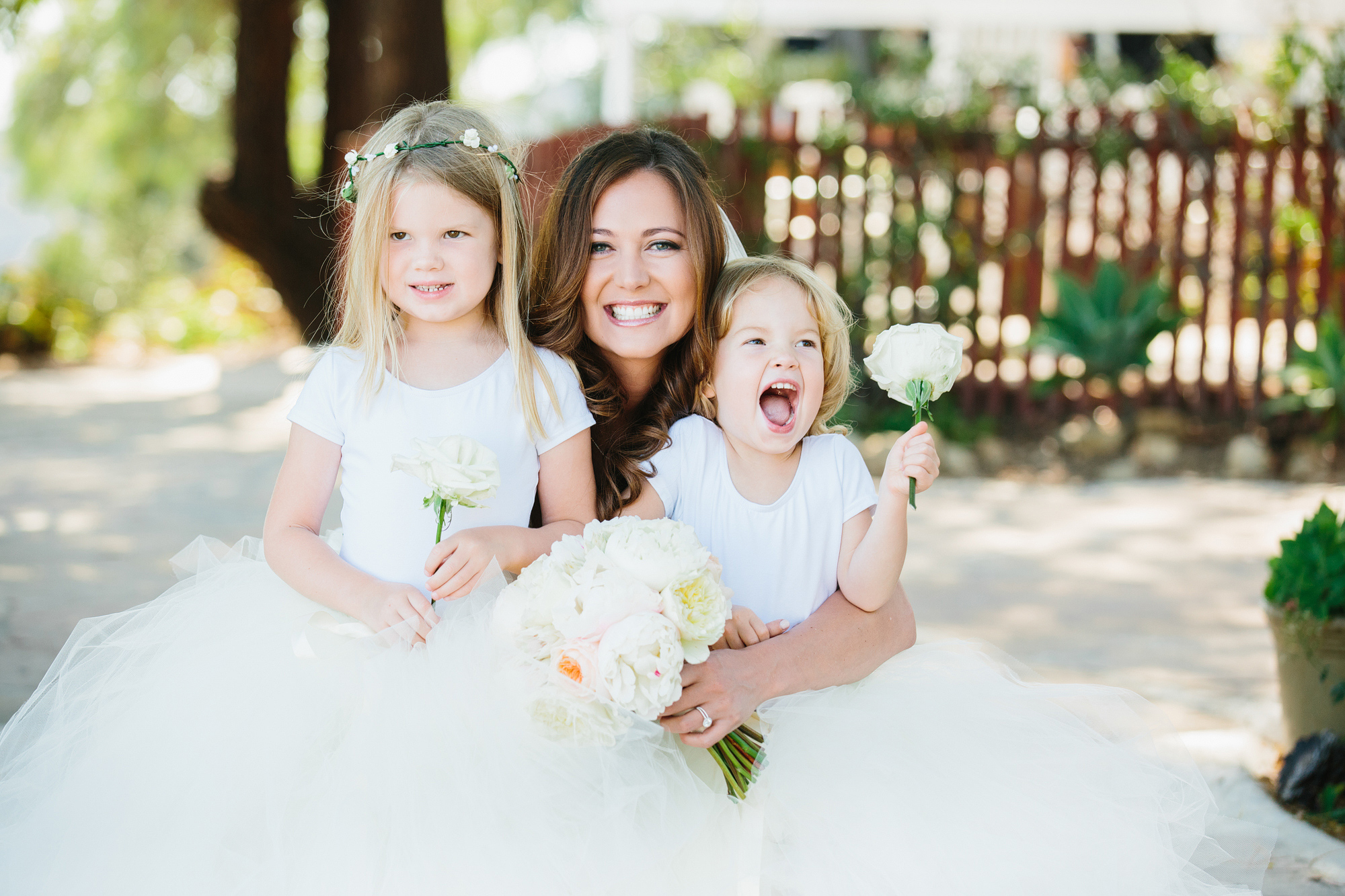 A photo of the bride and two of the flower girls. 