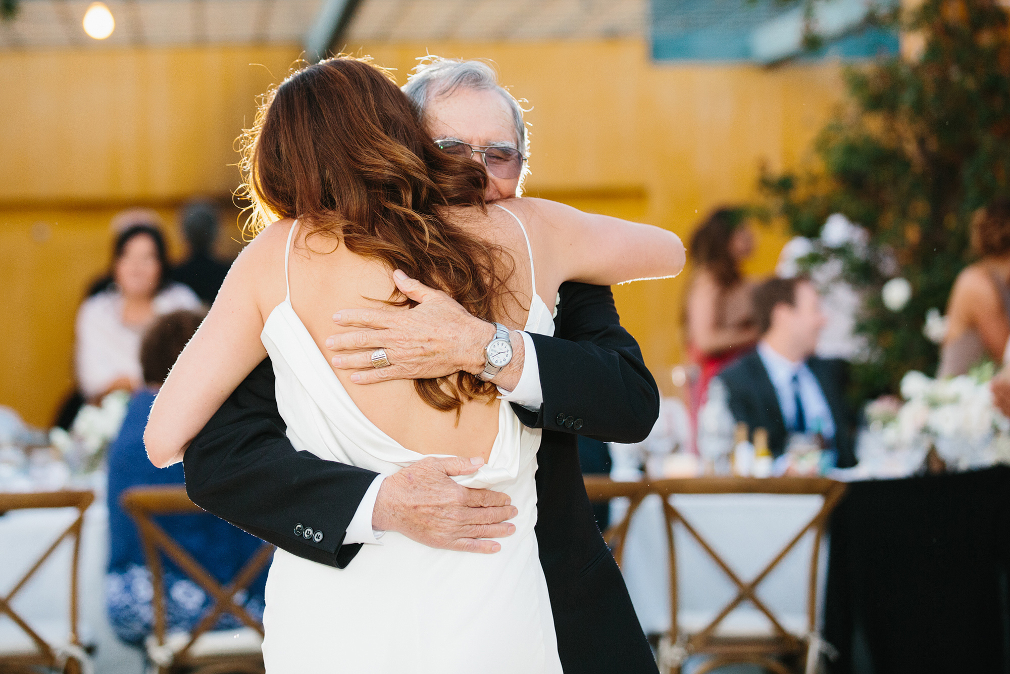The bride hugging her dad at the end of their dance. 