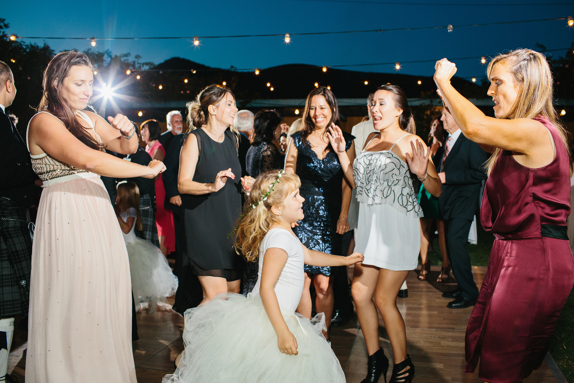 The guests and flower girl dancing during the reception. 