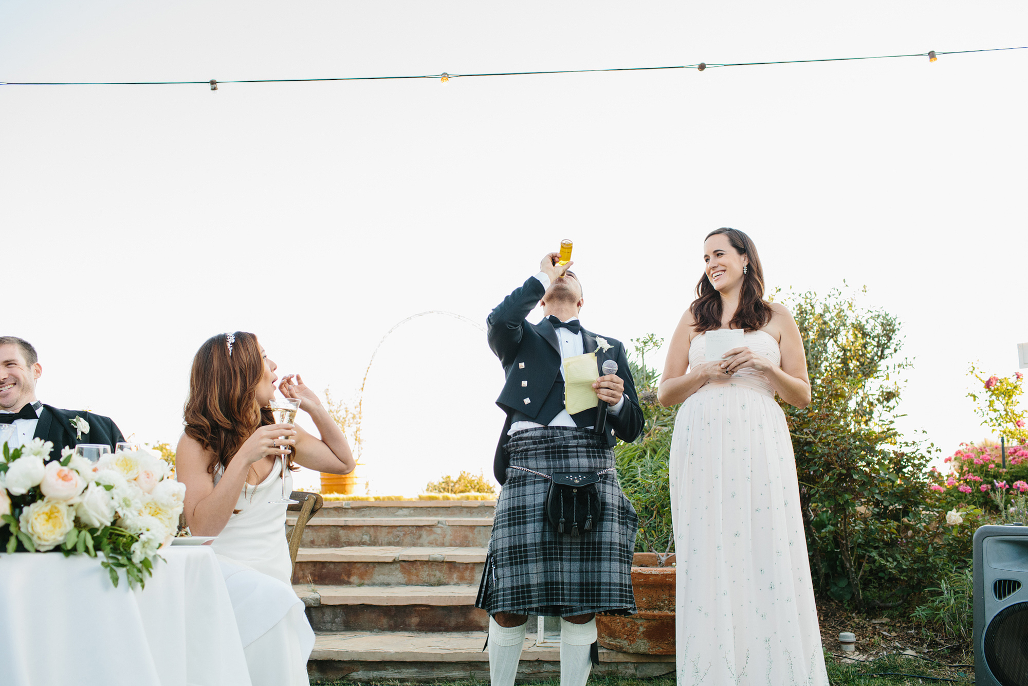 The best man drinking the olive oil favor. 