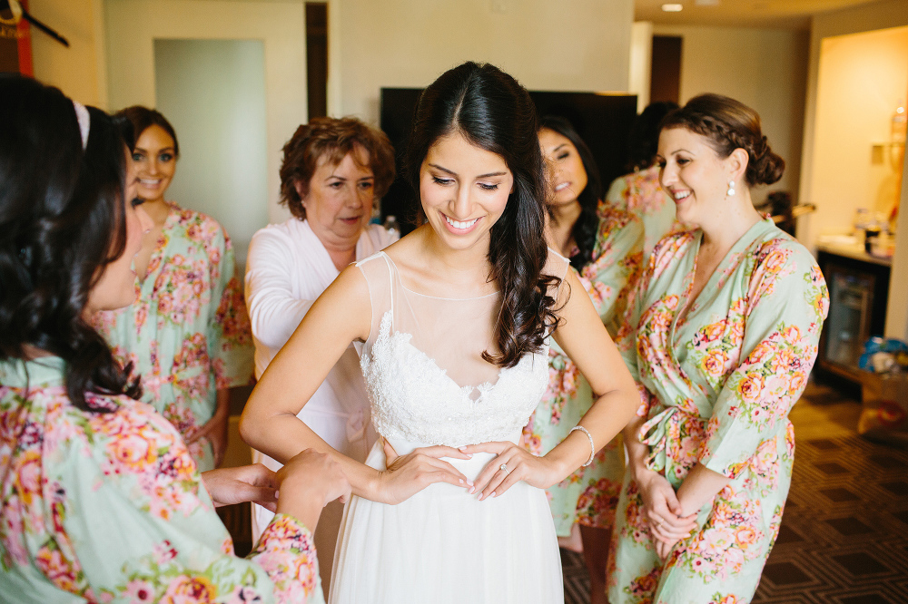 Cristina getting in her wedding dress. 