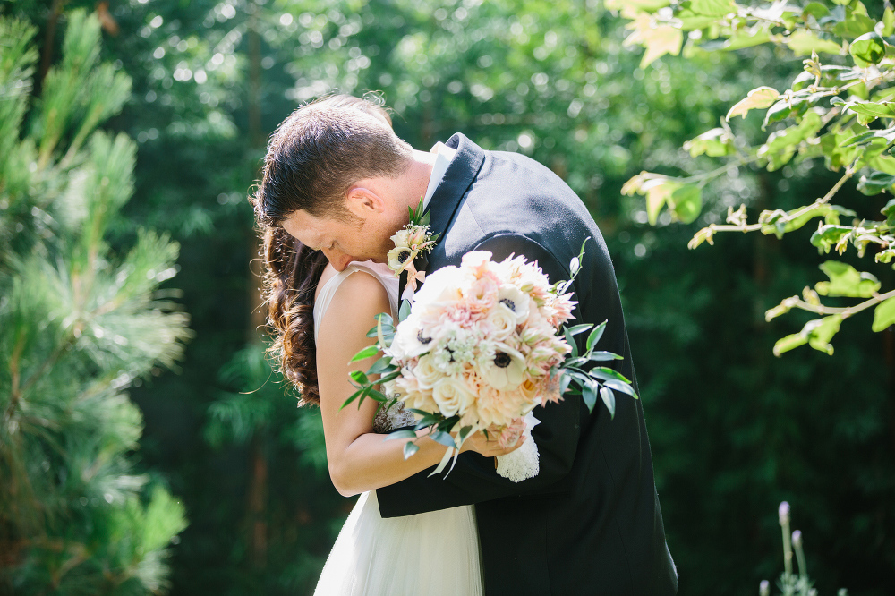 The groom hugging his bride. 