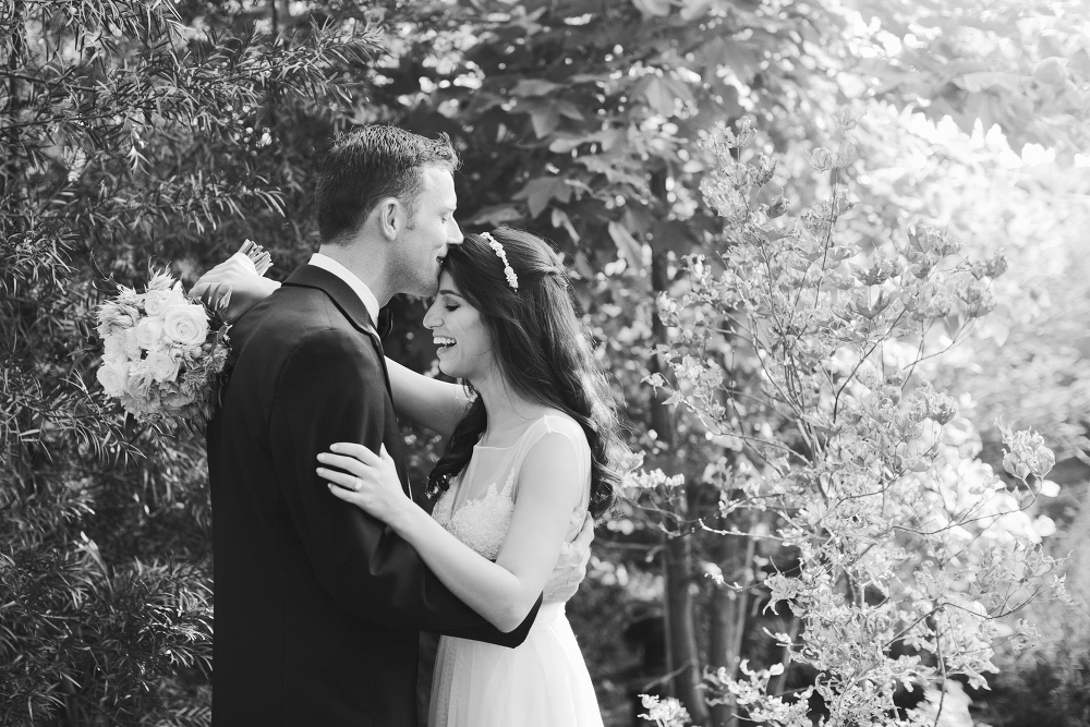 An adorable photo of the bride and groom laughing. 