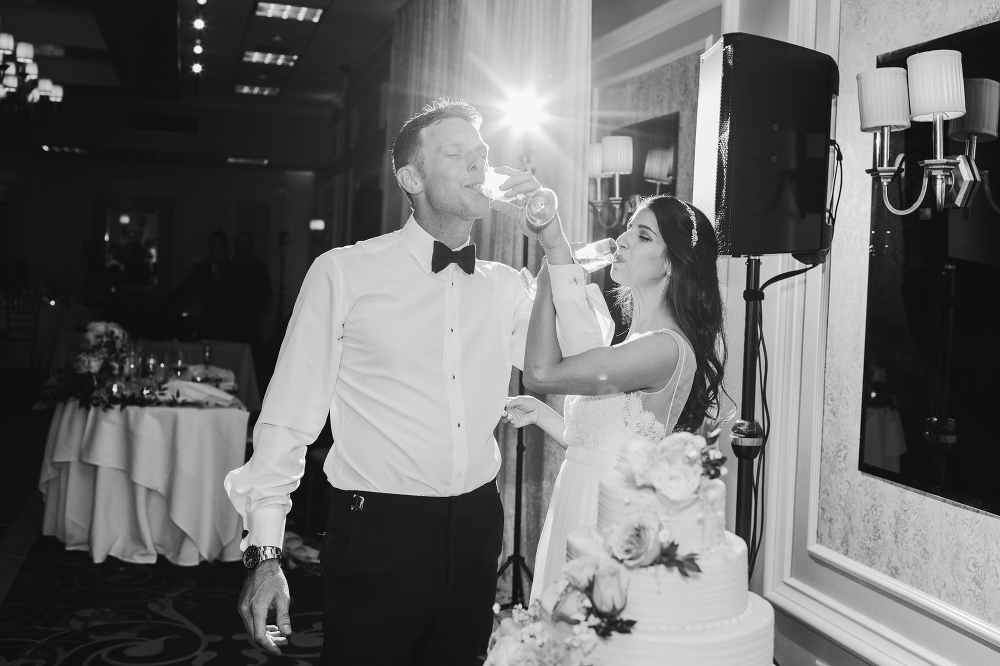The bride and groom sharing a sip of champagne. 