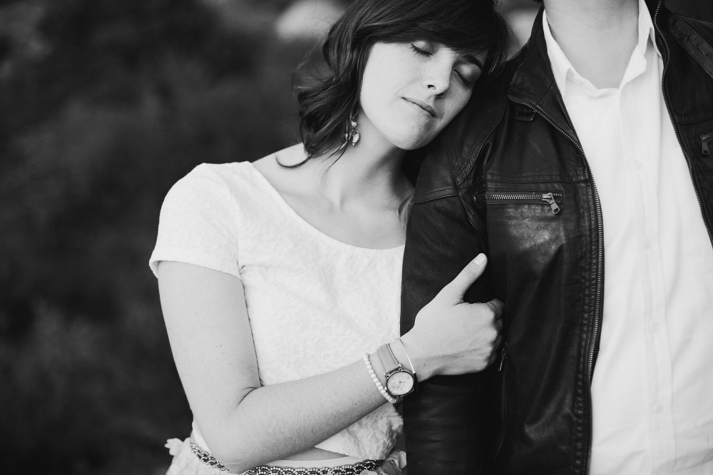 Jacqueline resting her head on Chris. 