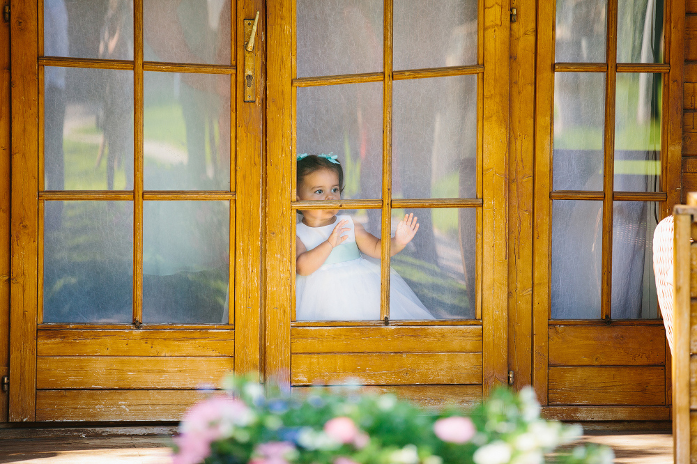 The flower girl looking out from the bridal suite. 