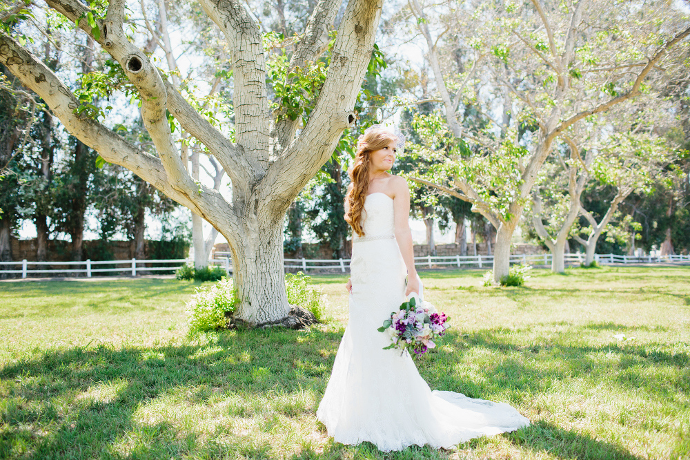 Carrie taking photos near the trees. 