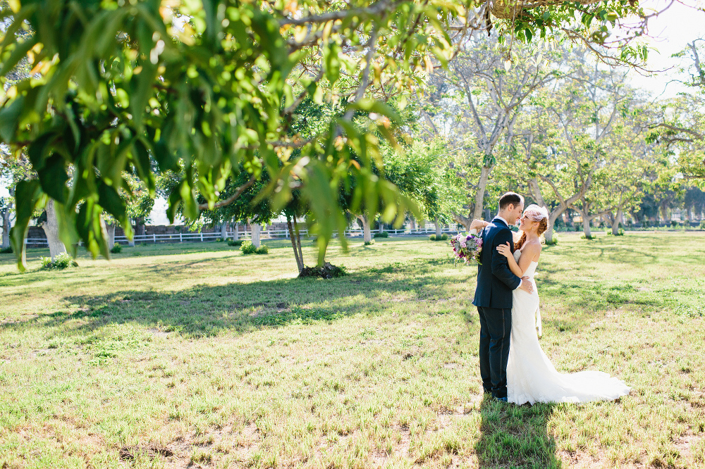 A photo of Carrie and Justin under the trees. 