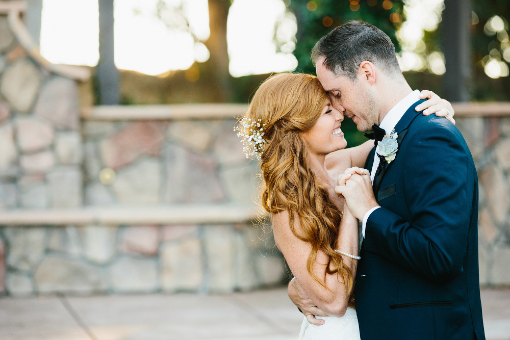 An adorable photo of the bride and groom during the first dance. 