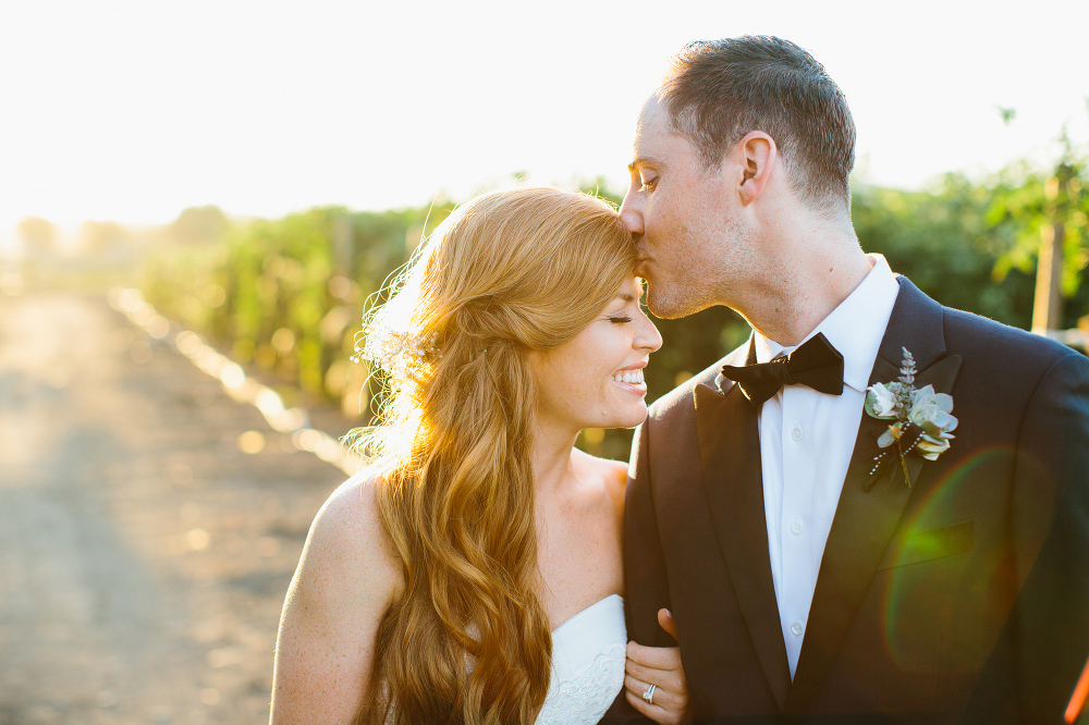 The groom kissing the bride