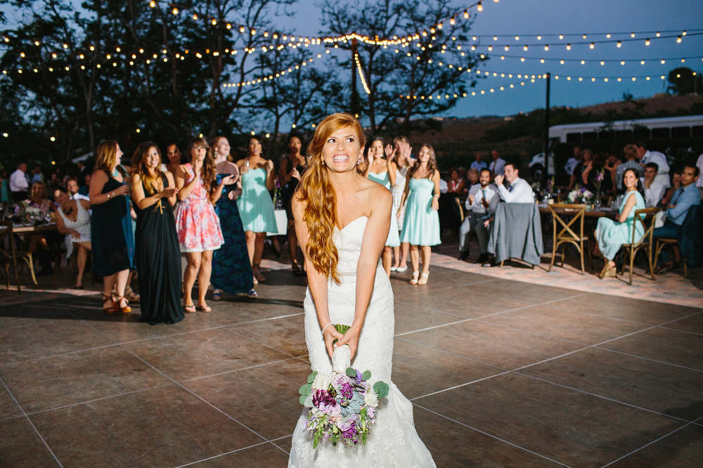 The bride tossing her bouquet. 