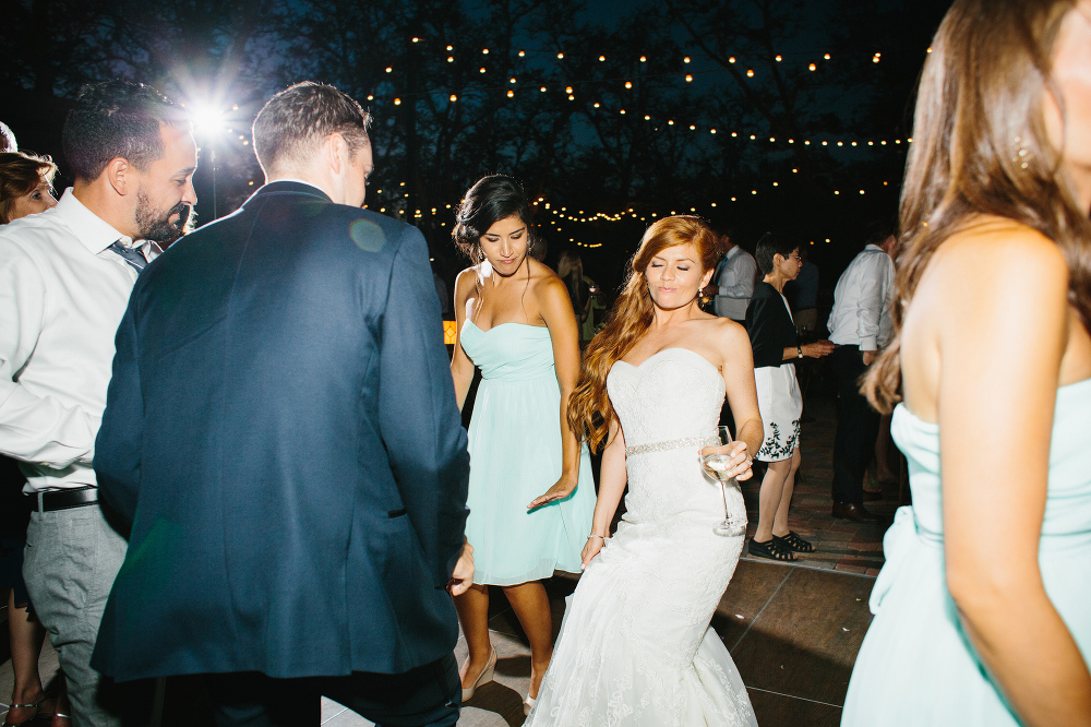 The bride and groom dancing together at the reception. 