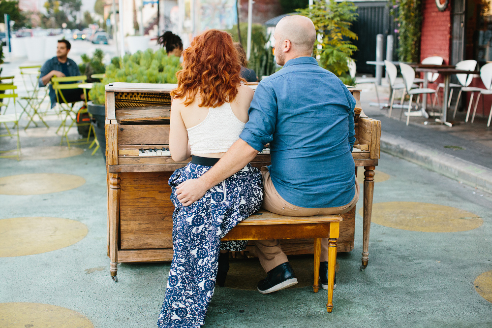 Afton and Jesse sitting at a piano. 