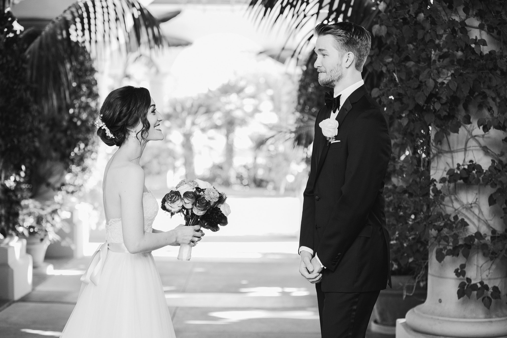 A sweet photo of the couple seeing each other on their wedding day. 