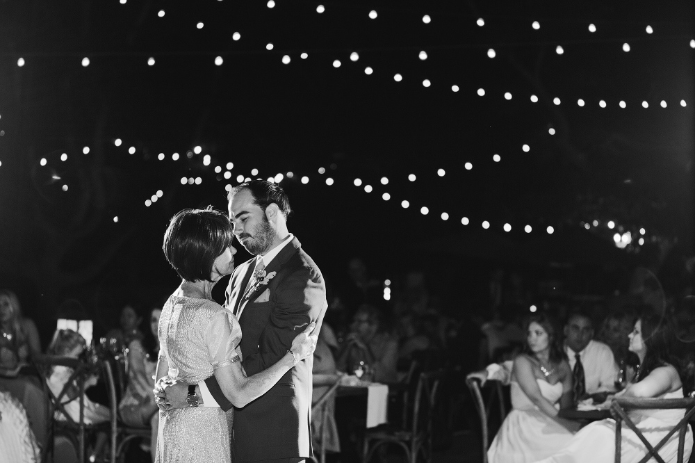 The groom dancing with his mom. 