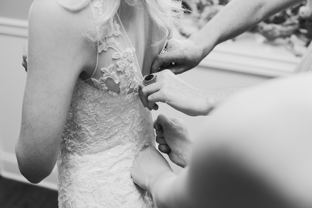 Lauren getting in her lace dress. 