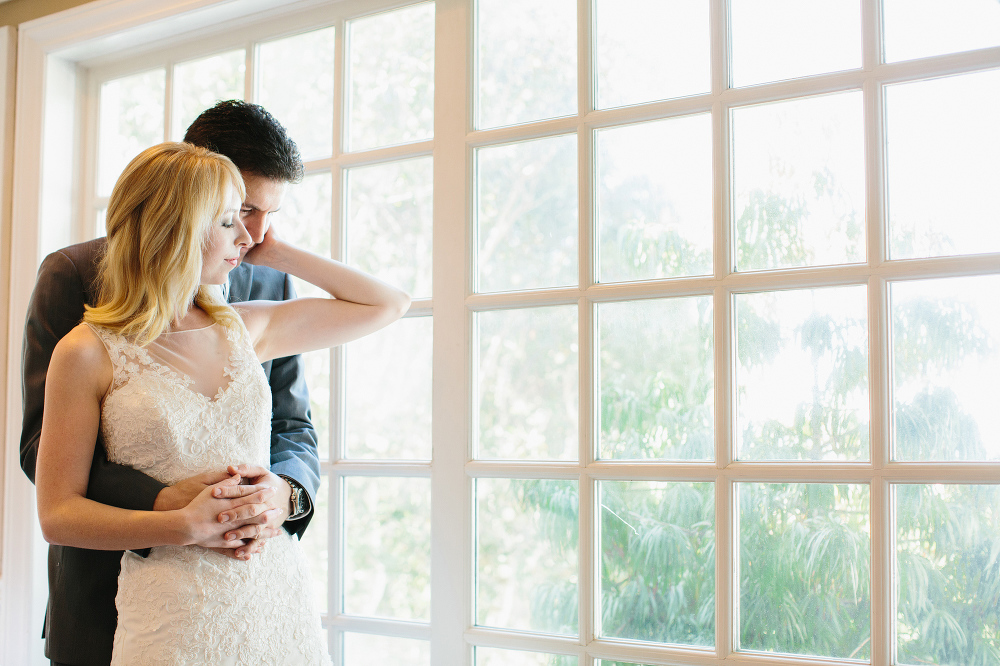 Lauren and Alex by a beautiful window. 