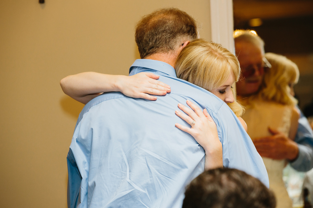 The bride hugging her dad after his toast. 