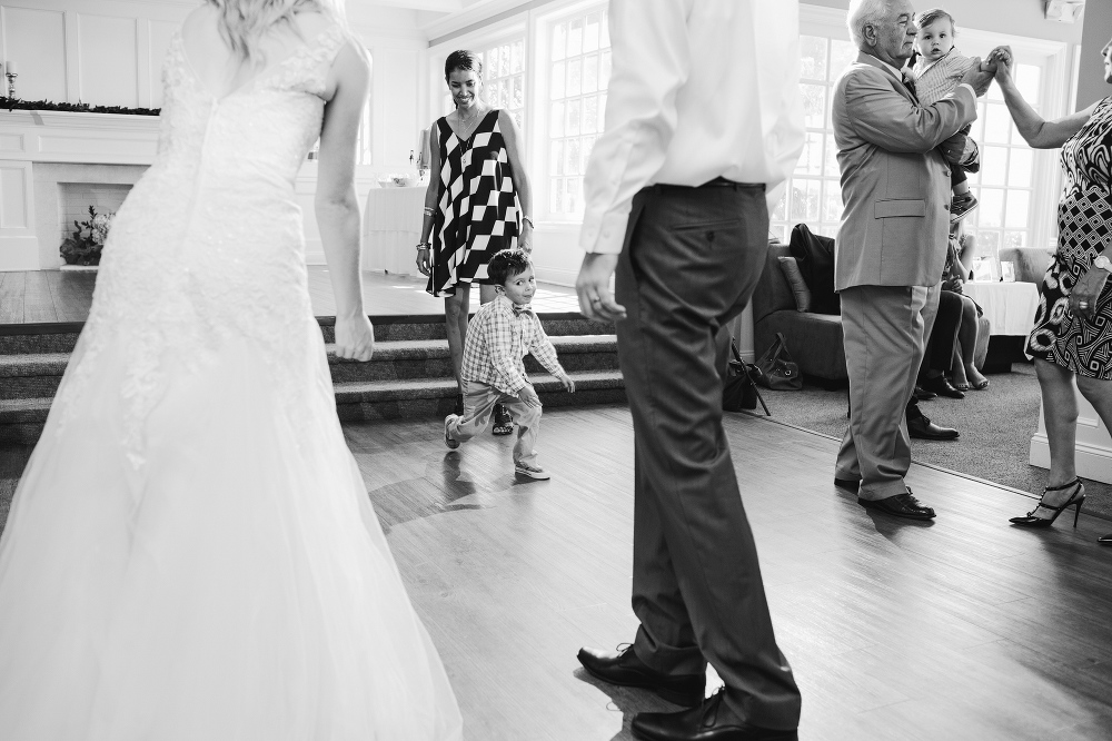 An adorable little boy dancing during the reception. 