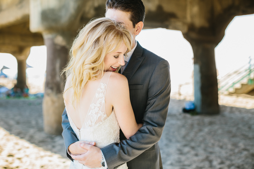 A cute photo of the groom holding the bride. 