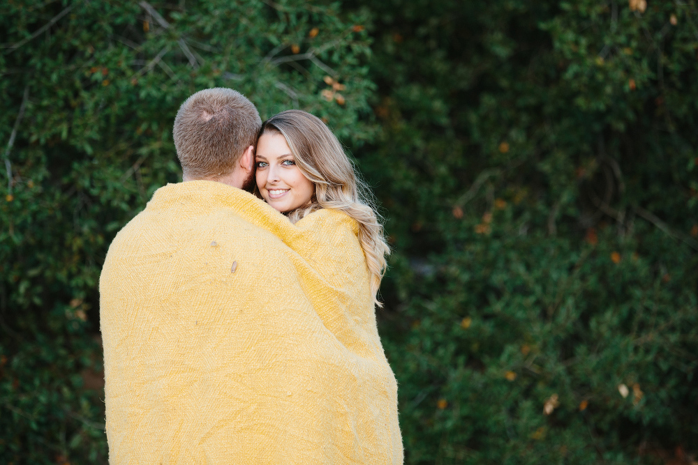 Hillary and CJ wrapped in a blanket. 