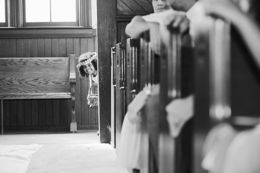 The adorable flower girl peeking around the corner. 